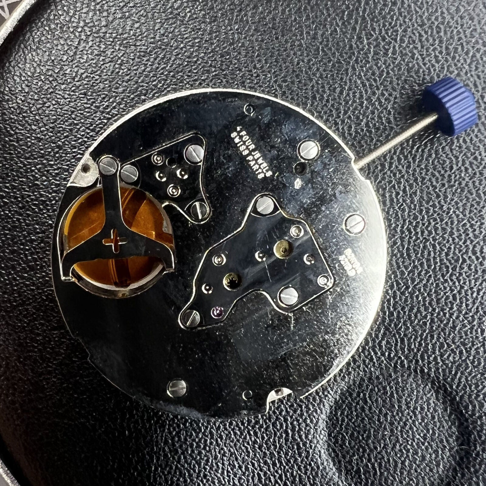 Swiss Made Ronda 4210B quartz watch movement, precise timekeeping component for watch repairs and accessories.