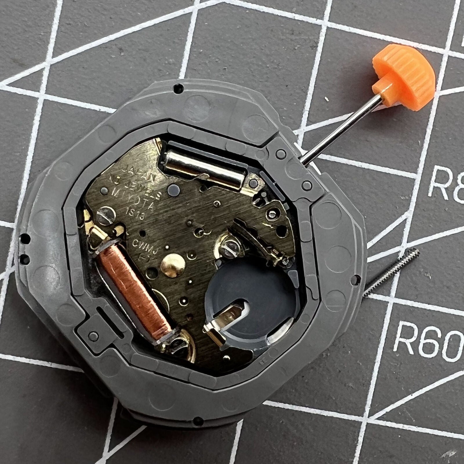 Miyota 1S13 quartz watch movement with date display at 6 o'clock, precise Japanese craftsmanship by Miyota.