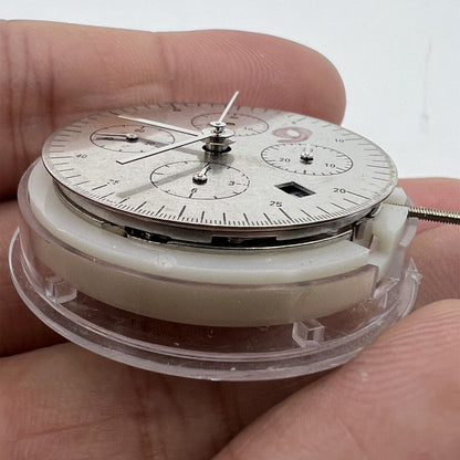 China Made 7750 mechanical watch movement with white dial, single calendar, and small seconds subdials at 3, 6, and 9 o'clock.