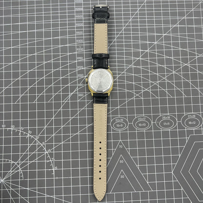 Black Dandong manual mechanical watch with 17 jewels, golden dial, single calendar for refined classic style.