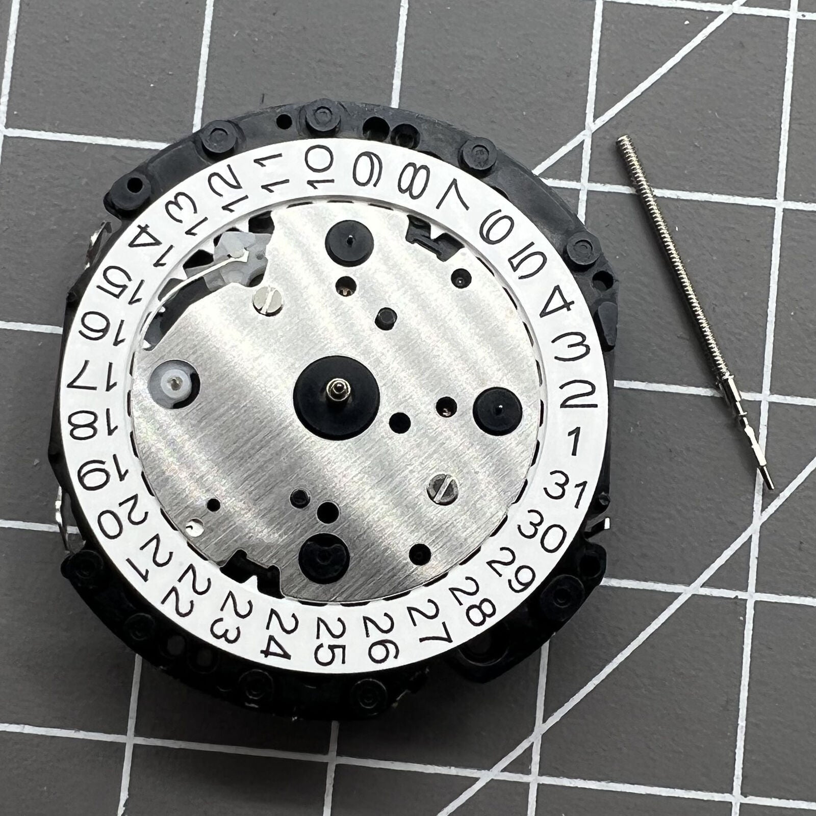 Japan Made Hattori Epson TMI VD53 quartz watch movement with date display at 3, 6, and 4:30 positions.