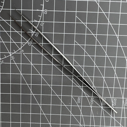 Swiss Made Bergeon 7027-SS tweezer with fine stainless steel tips for precise watch repair.