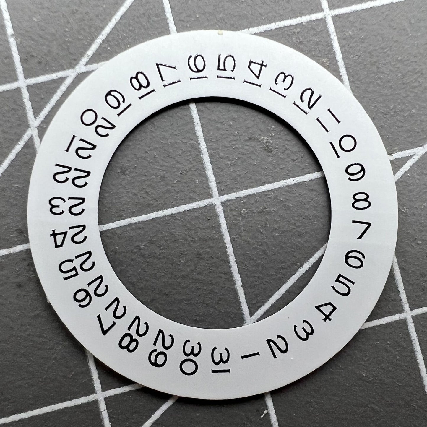 Thickening white date wheel overlay for ETA2824 movement with date window at 3 o'clock.