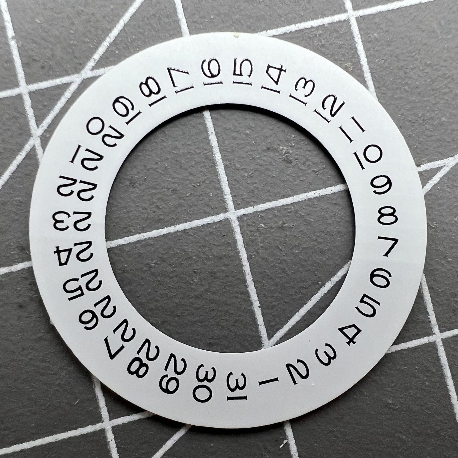 Thickening white date wheel overlay for ETA2824 movement with date window at 3 o'clock.