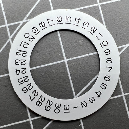 Thickening white date wheel overlay for ETA2824 movement with date window at 3 o'clock.