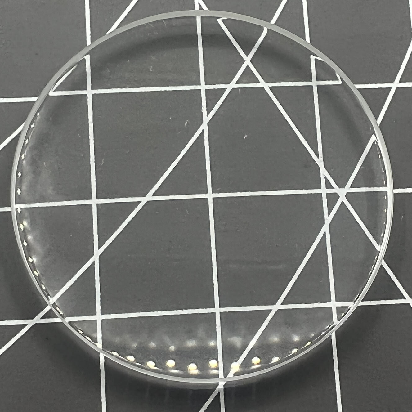 Set of five dome watch glass crystals, 25-35mm, 1.5-2.5mm thick, ideal for watch repair and replacement.