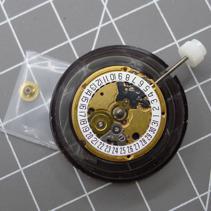 Swiss Made ETA 956.112 quartz watch movement with 3 hands and date display at 6 o'clock.