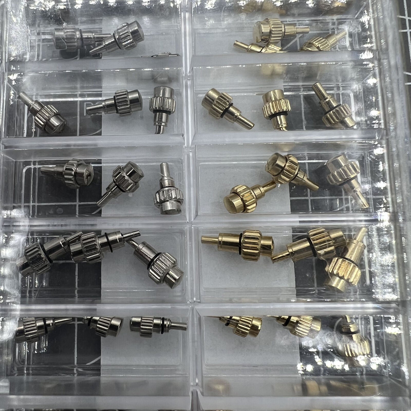 Set of 54 AB-619PCF watch crown chronograph pushers with flat head for precise button repair and replacement.