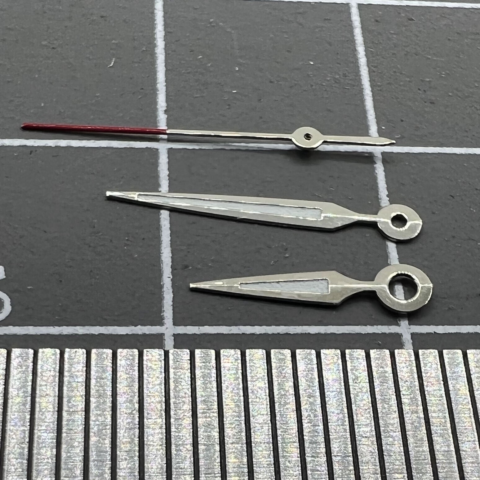 Luminous arrow-shaped watch hands by Miyota, perfect for enhancing visibility in low light conditions.