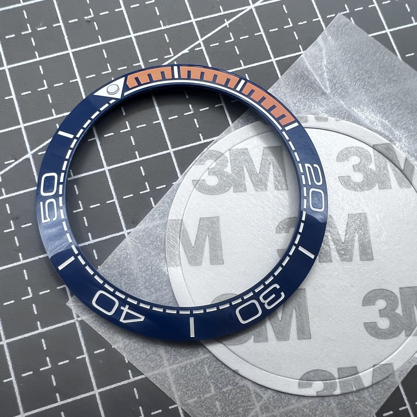 Keramik L�netteneinlage Dunkelblau 41,5mm x 32,5mm mit oranger Schrift f�r Uhrteile