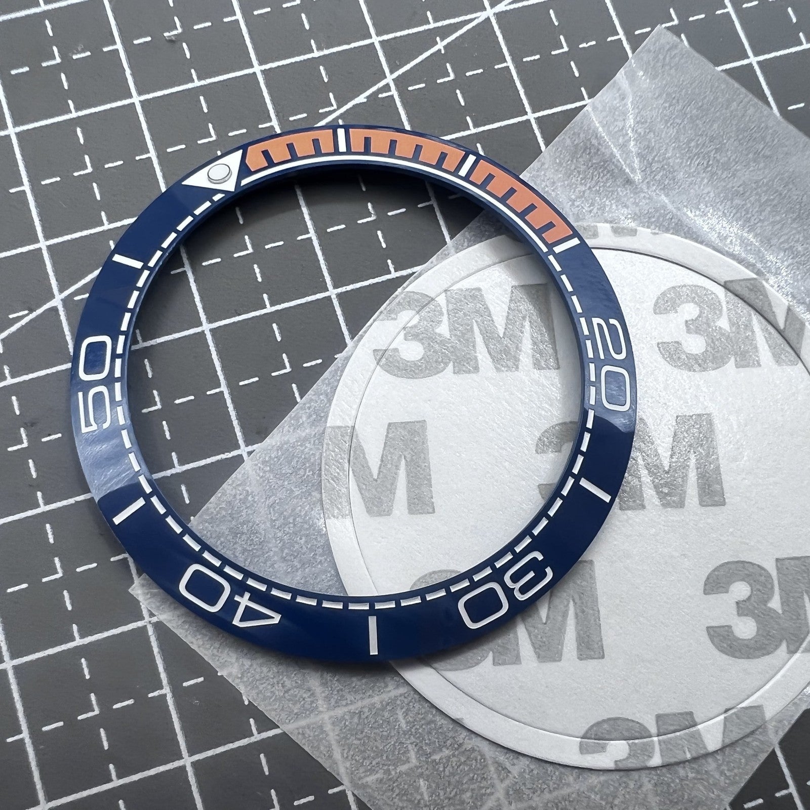 Keramik L�netteneinlage Dunkelblau 41,5mm x 32,5mm mit oranger Schrift f�r Uhrteile