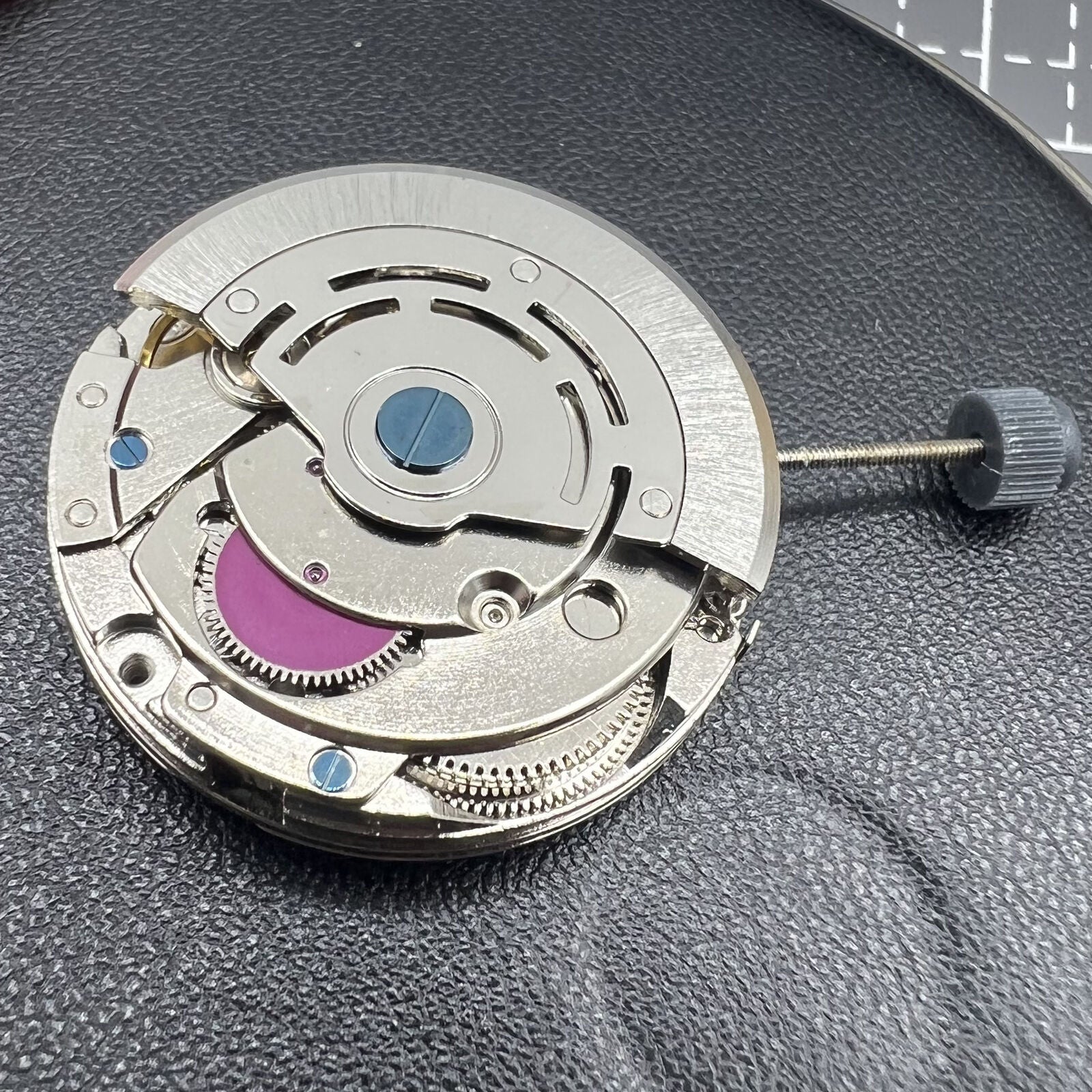 1. NN 8205 8215 automatic watch showcasing sleek mechanical movement and single calendar.  