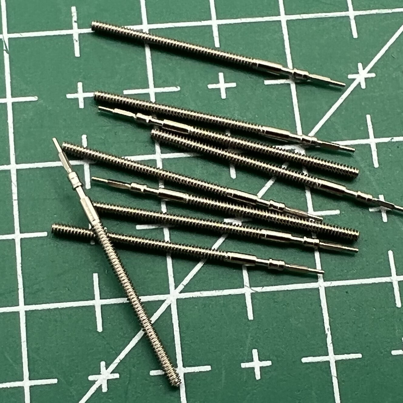 Generic watch winding stems for 1M02, 1L22, 1M12, 1L02 movements, ideal for repair and replacement.