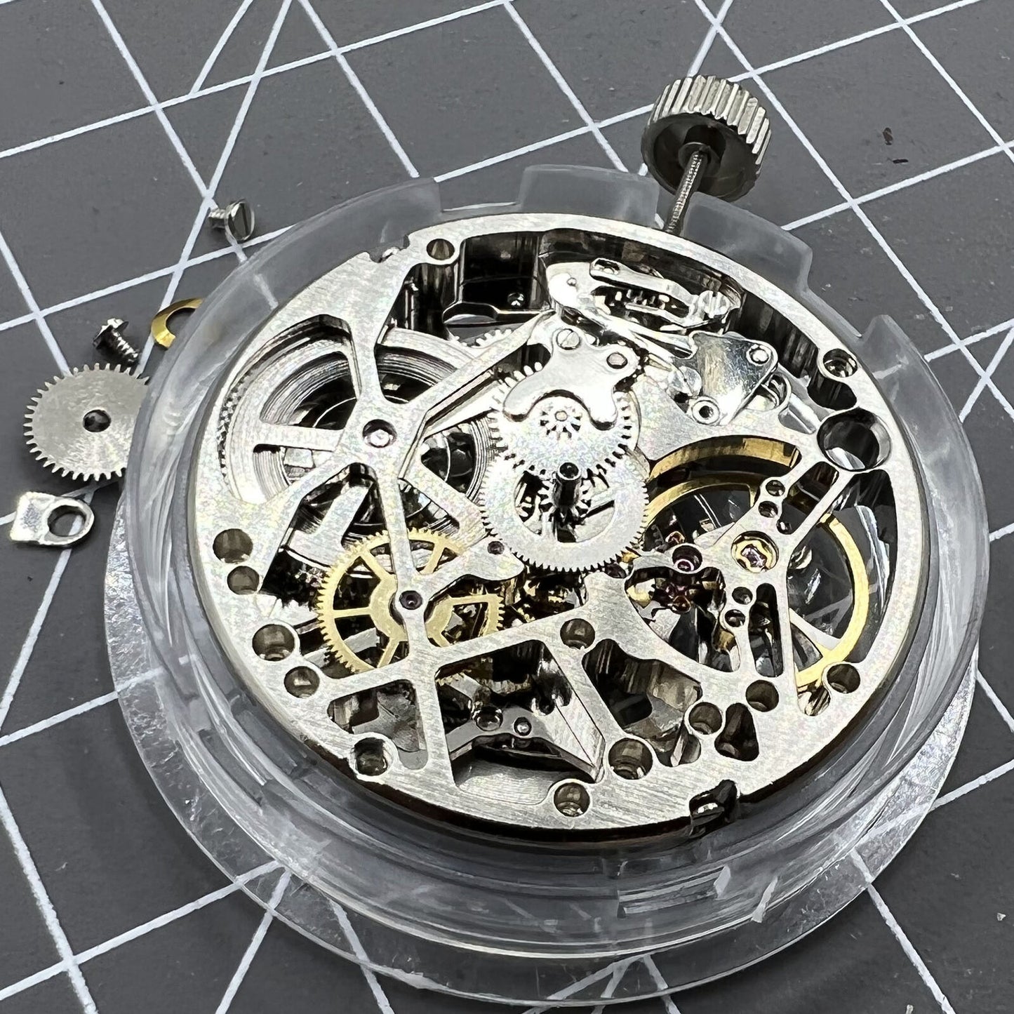 Tianjin Seagull ST25 silver automatic watch movement with hollow 3-hand mechanical design.