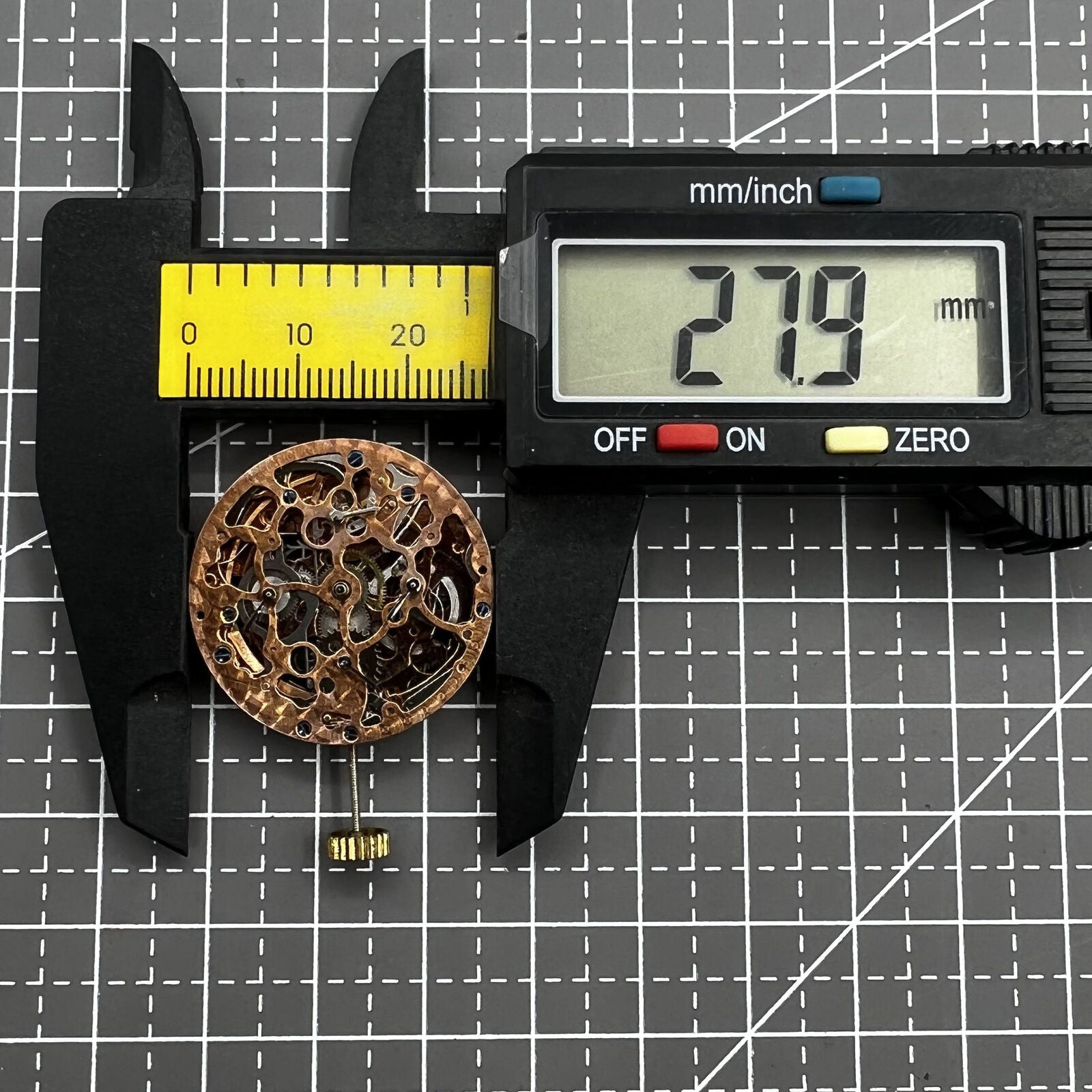 Hollow rose gold watch featuring mechanical movement, 4 subdials, and 7 hands for precise timekeeping.