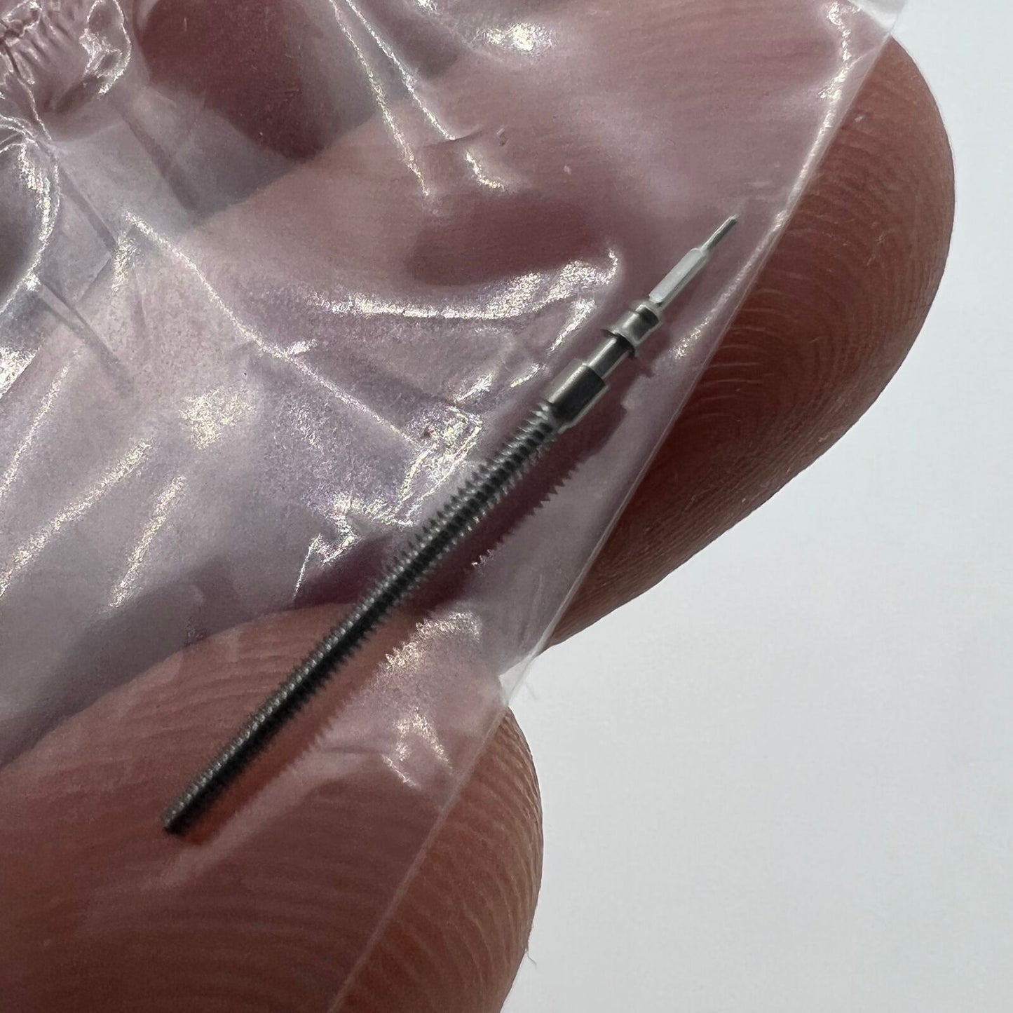 Replacement winding stem for Miyota 6M50 quartz watch, precise fit for easy repairs.
