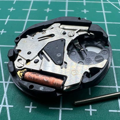 Hattori Epson TMI VX12E quartz watch movement featuring date display at 3 o'clock for accurate timekeeping.