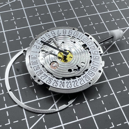 Swiss ISA 8171A quartz watch movement with white dial, four hands, and date at 6 o?clock for precise timekeeping.