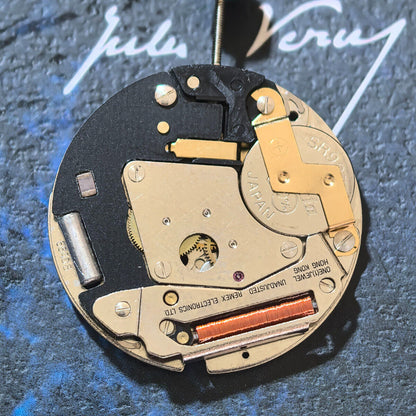 Swiss Made ETA 6640B quartz watch movement with black circuit board and three hands for precise timekeeping.