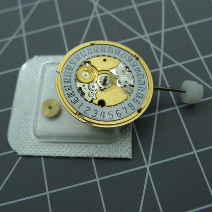 Swiss ETA 956.412 quartz watch movement with date at 6, 3 hands, precise Swiss-made accessory for watch repairs.