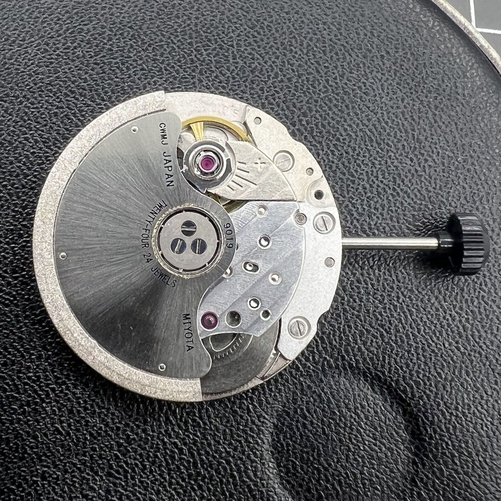 Miyota/Citizen 9019 automatic watch movement with dual date windows at 3 and 6, precision Japan-made mechanism.