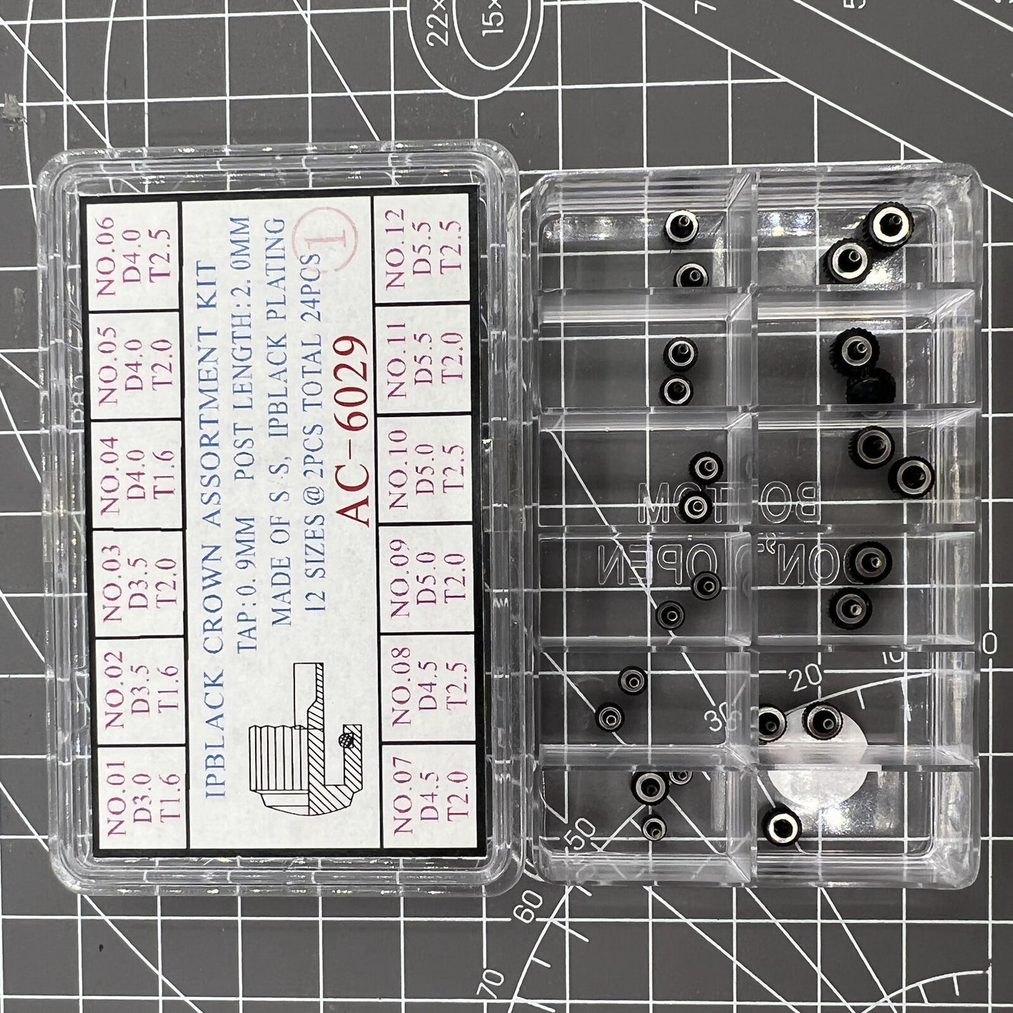 Black plated stainless steel watch crowns, 24 pieces in 12 sizes, perfect for watch repairs and customization.