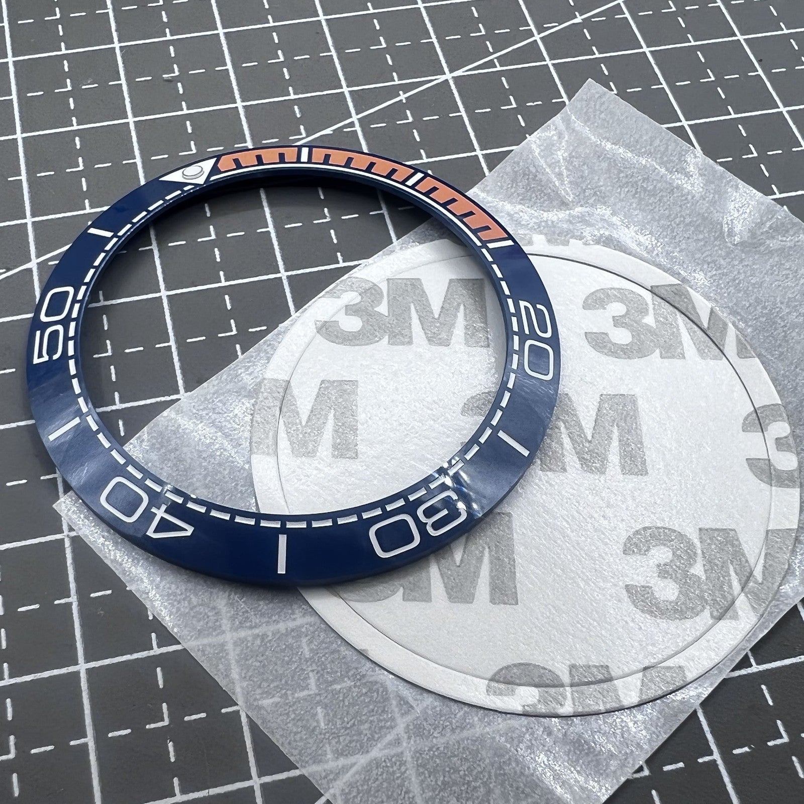 Keramik L�netteneinlage Dunkelblau 41,5mm x 32,5mm mit oranger Schrift f�r Uhrteile