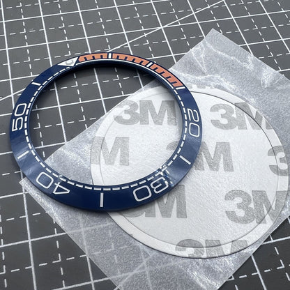 Keramik L�netteneinlage Dunkelblau 41,5mm x 32,5mm mit oranger Schrift f�r Uhrteile
