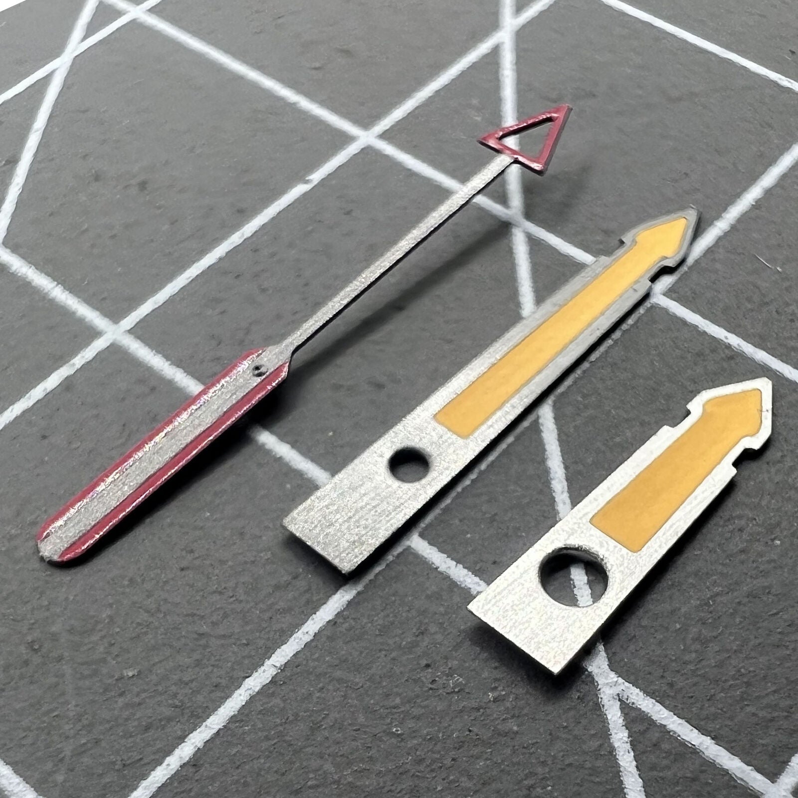 Arrow-shaped yellow luminous watch hands with black trim, compatible with NH35, NH36, 4R, and 7S movements.