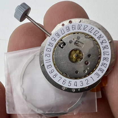 Golden silver-gilted Swiss RONDA 785 calendar quartz movement for precise watch accessory repair.