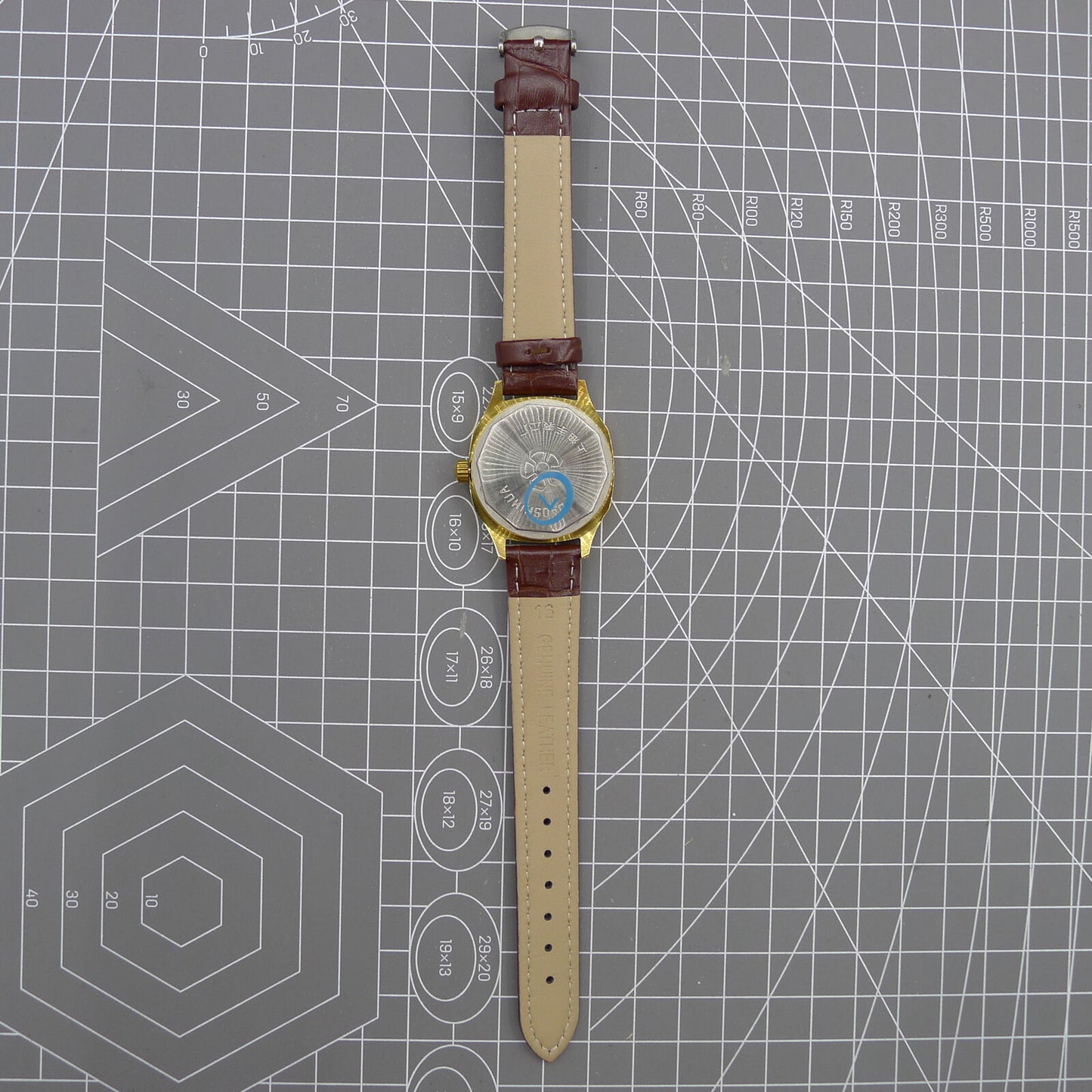 33mm Shanghai watch with blue dial, golden nail markers, square case, manual movement by Shanghai brand.