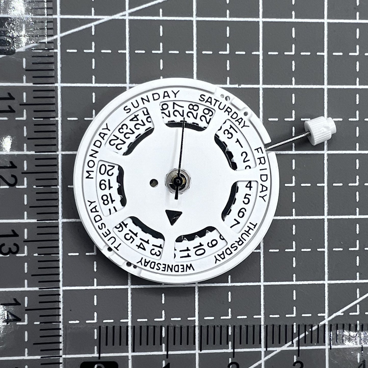 Swiss ISA 1198 quartz watch movement with day and date function for precise timekeeping.