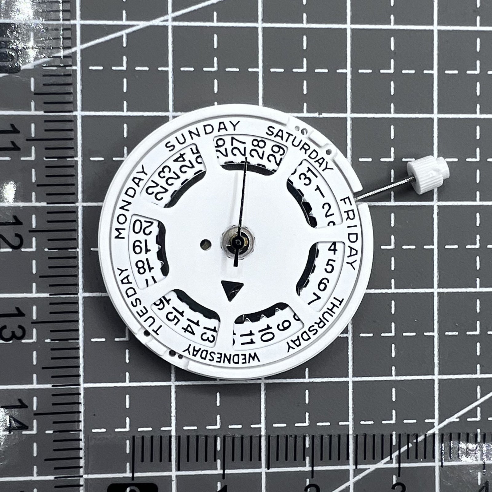 Swiss ISA 1198 quartz watch movement with day and date function for precise timekeeping.