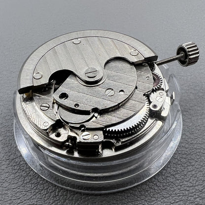 Tianjin ST17 T17 hand-wound watch movement with two hands and power reserve indicator at 10 o'clock.