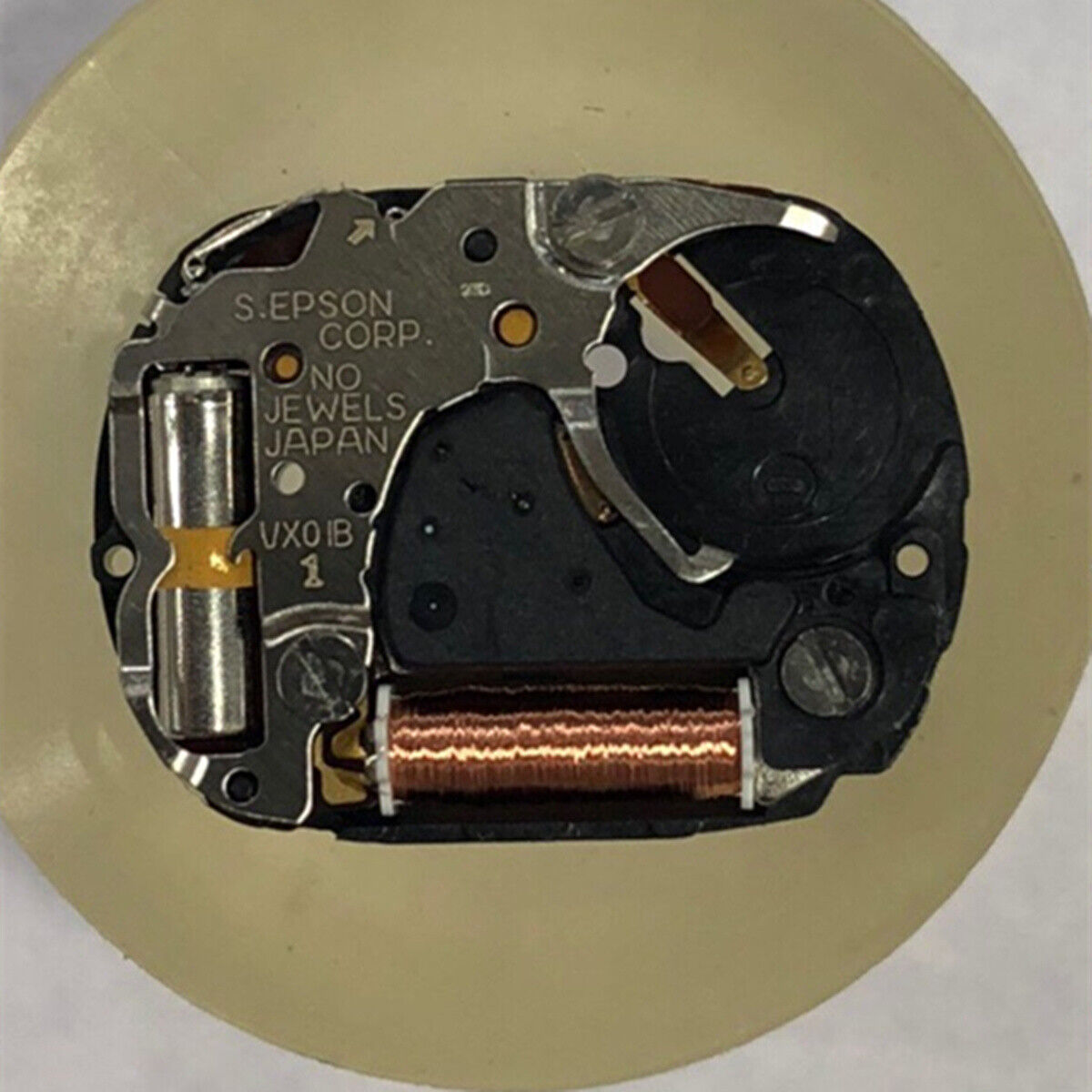 1. Hattori Japan VX01 quartz watch movement with 3 hands and stem, precise timekeeping accessory.  