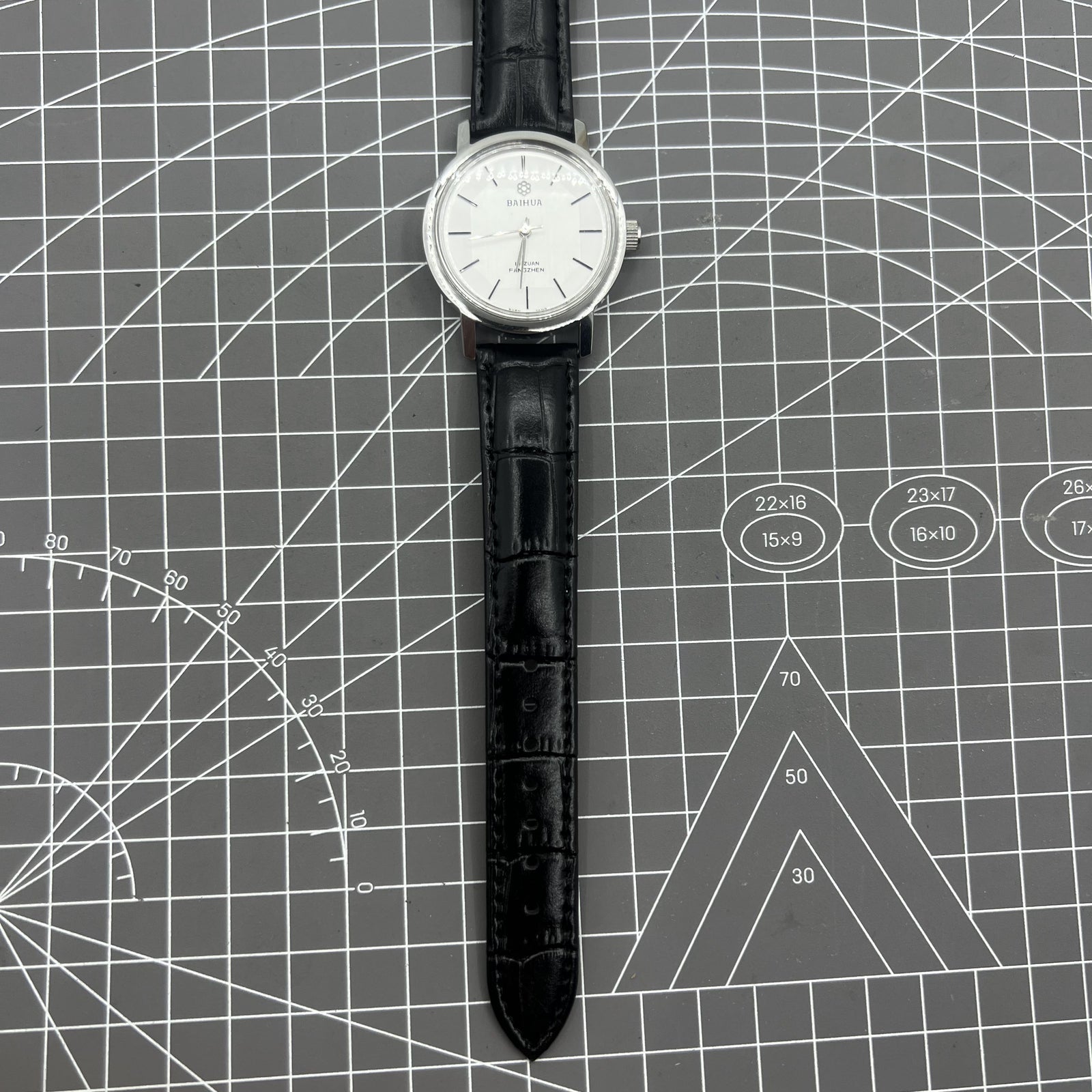 37mm China Baihua manual watch with 19 jewels, silver dial, shock-resistant for durable style.