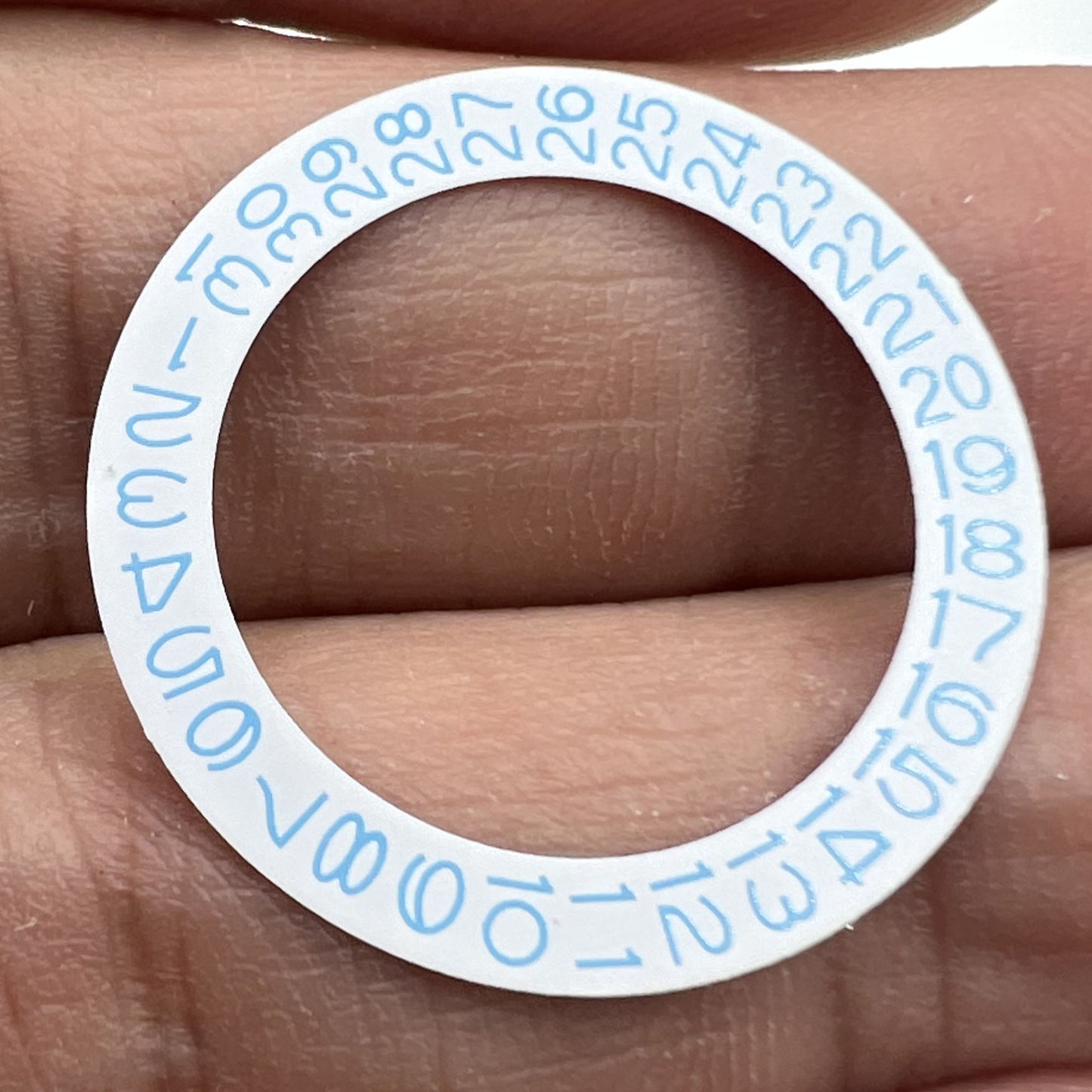 Sky blue date wheel disk for Miyota NH35 NH36 watch movement, white background, precise design.