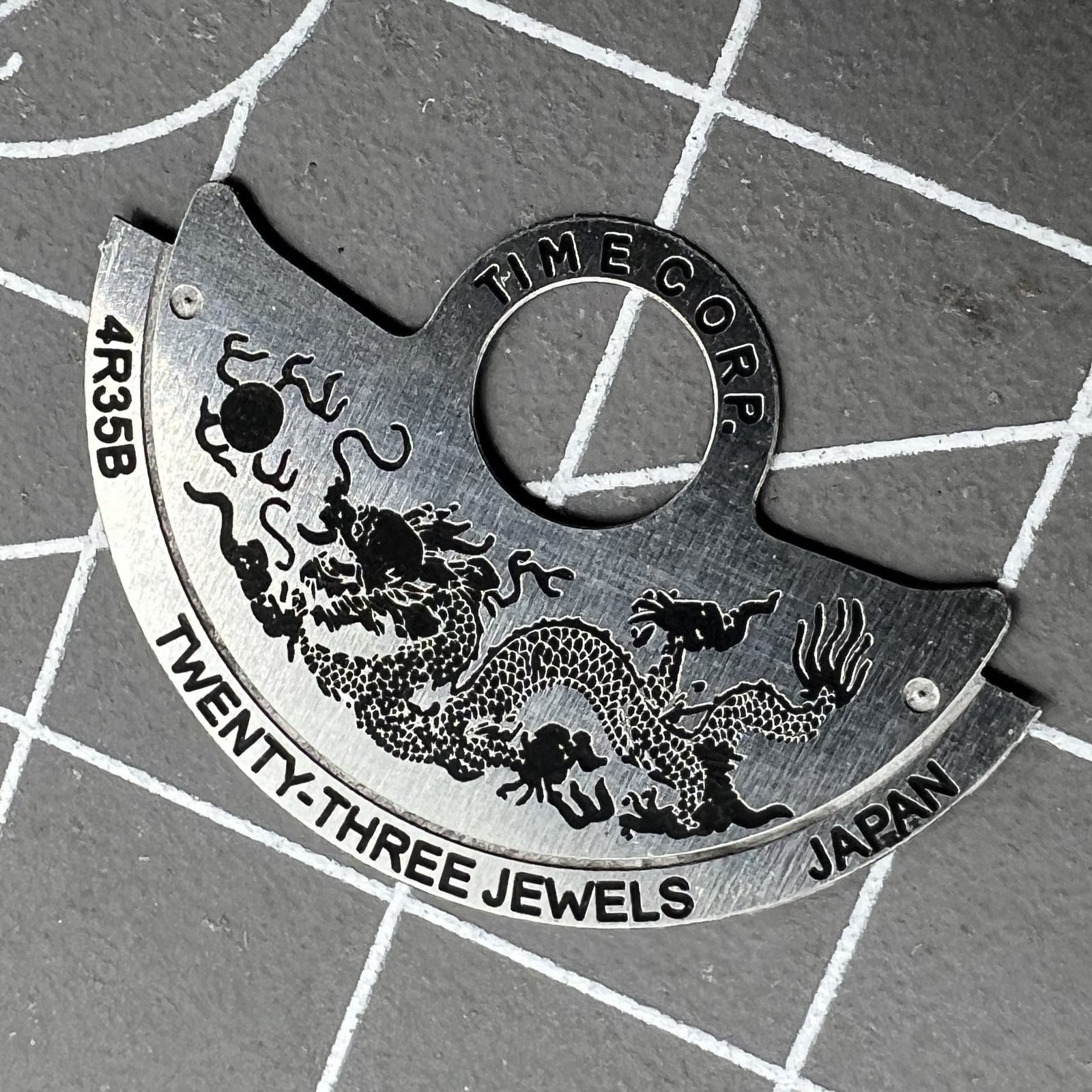 Dragon-themed silver rotor overlay for NH35 NH36 4R35 watch movements by Dragon~China, enhancing watch aesthetics.