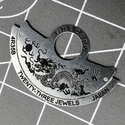 Dragon-themed silver rotor overlay for NH35 NH36 4R35 watch movements by Dragon~China, enhancing watch aesthetics.