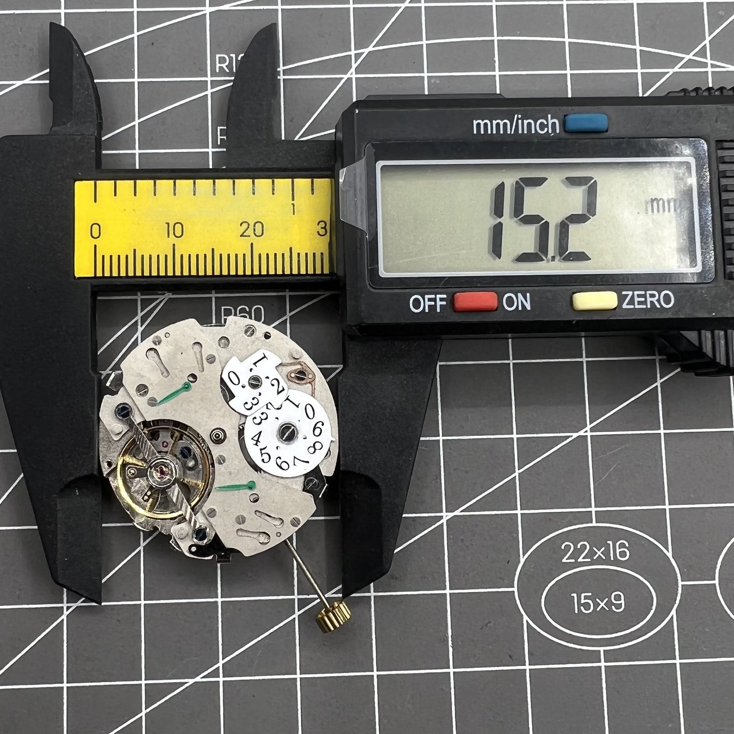 Automatic mechanical watch featuring reversed balance wheel and big date display at 12 o'clock.