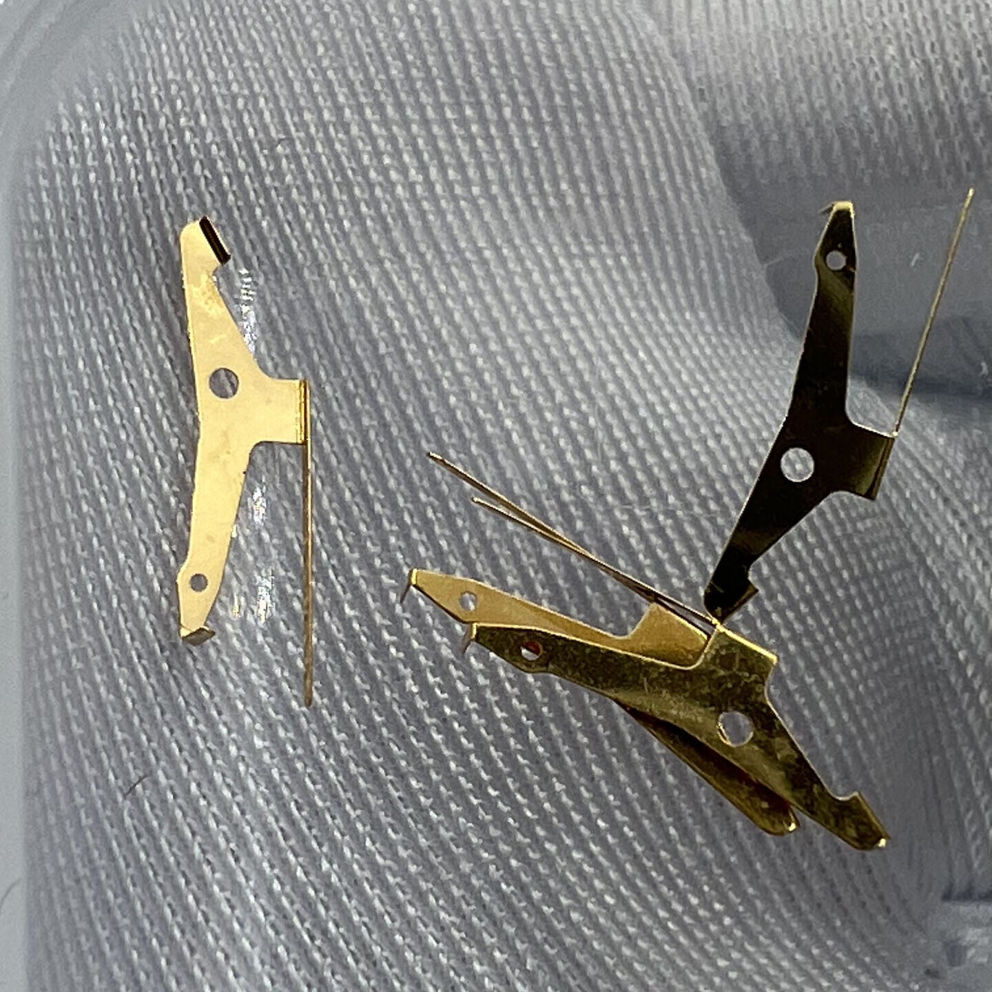 Golden spring jumper for ETA C01.211 watch part, precision fit ensuring smooth movement.