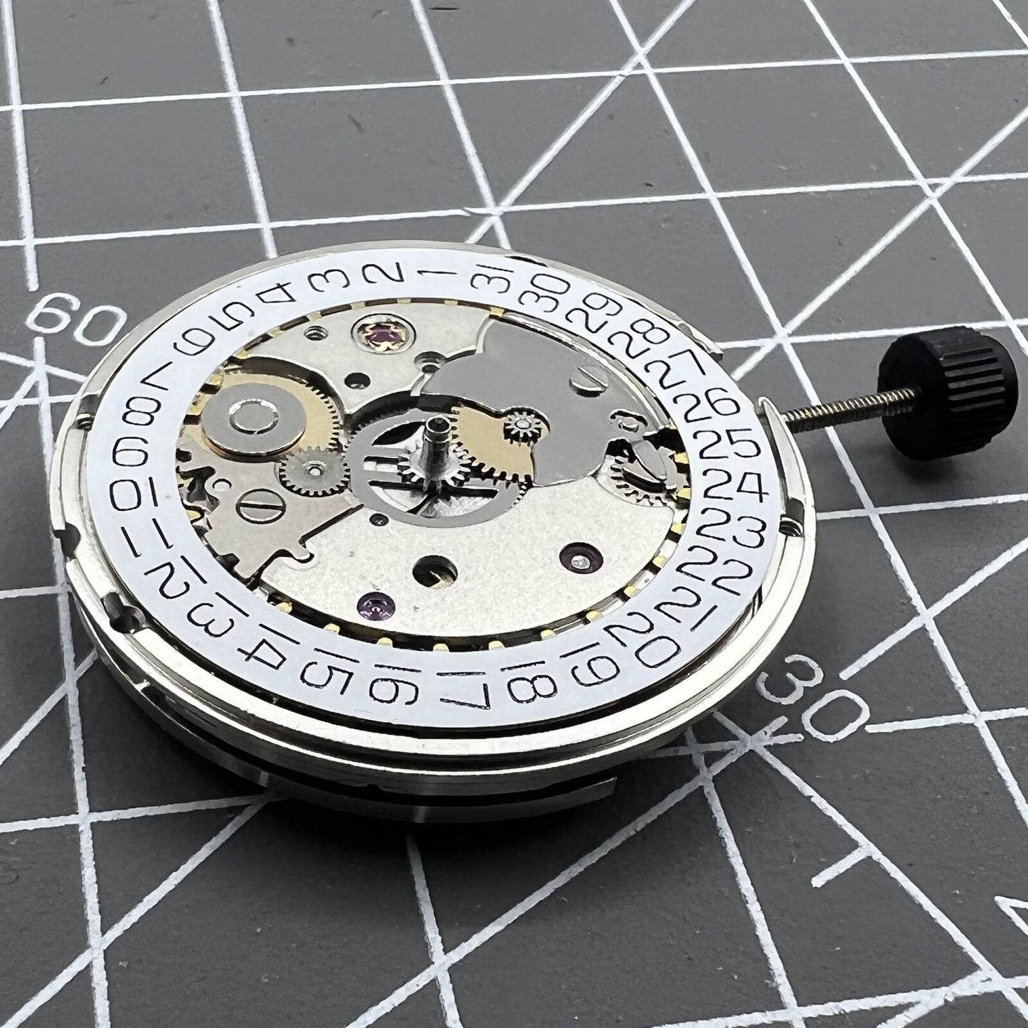 Silver ETA SW200-1 automatic watch movement, precise mechanical replacement for timepieces.