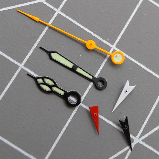 Black trim luminous orange second hand for Miyota 0S80 watch movement with green glow accents.