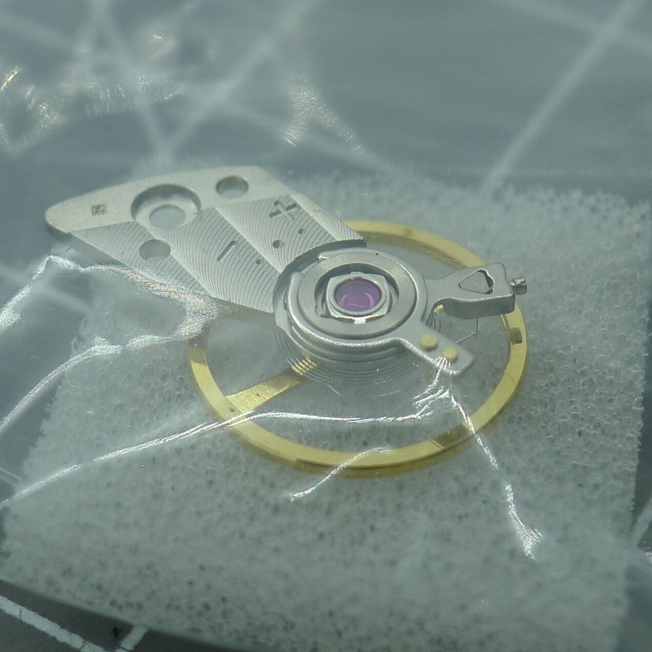 Silver balance wheel with splint for Miyota 82S7 watch movement, precision Japan-made component.