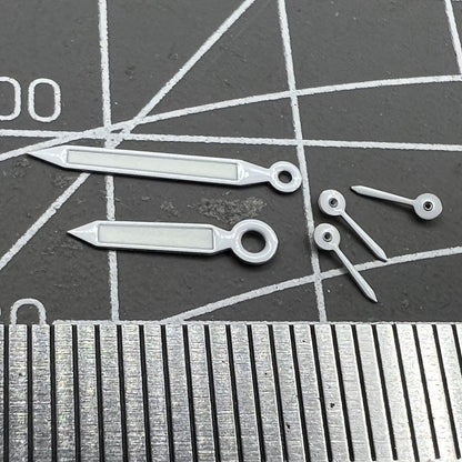 White trim green lume watch hands for Miyota OS20 movement, enhancing legibility and style.