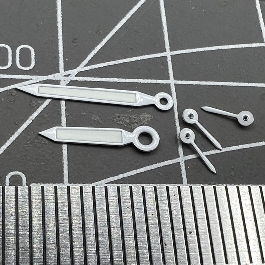 White trim green lume watch hands for Miyota OS20 movement, enhancing legibility and style.