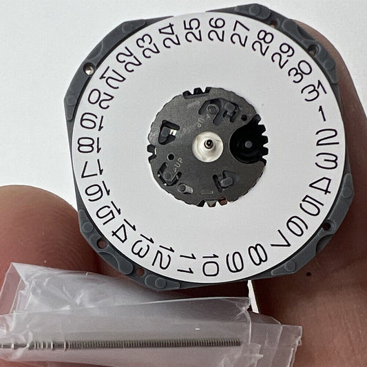 Hattori Epson TMI VJ52 quartz watch movement with date at 3 o'clock, precision Japanese craftsmanship.