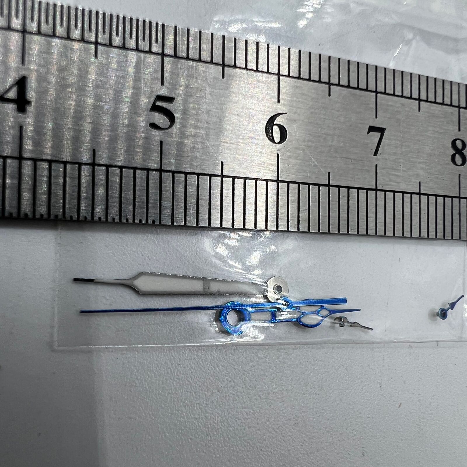 Blue trim green lume watch hands designed for Miyota OS10 and 0S10 movements, enhancing visibility and style.