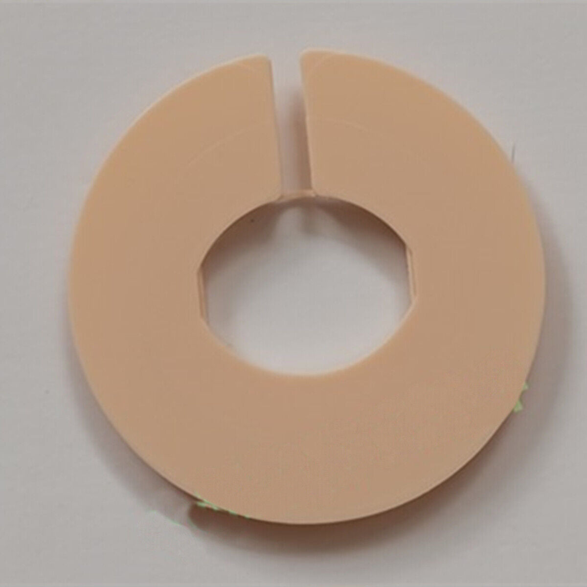 Plastic watch case cushion mount spacer ring for ISA257.130 movement, durable replacement part.