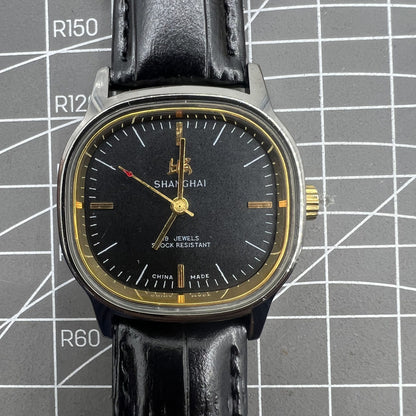 Shanghai Factory 34mm manual mechanical watch with black dial, 19 jewels, shock-resistant, classic timepiece.